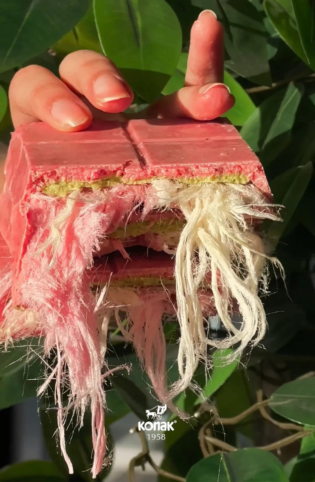 The Angel Hair chocolate bar from a different perspective, highlighting the smooth pink chocolate and airy texture.