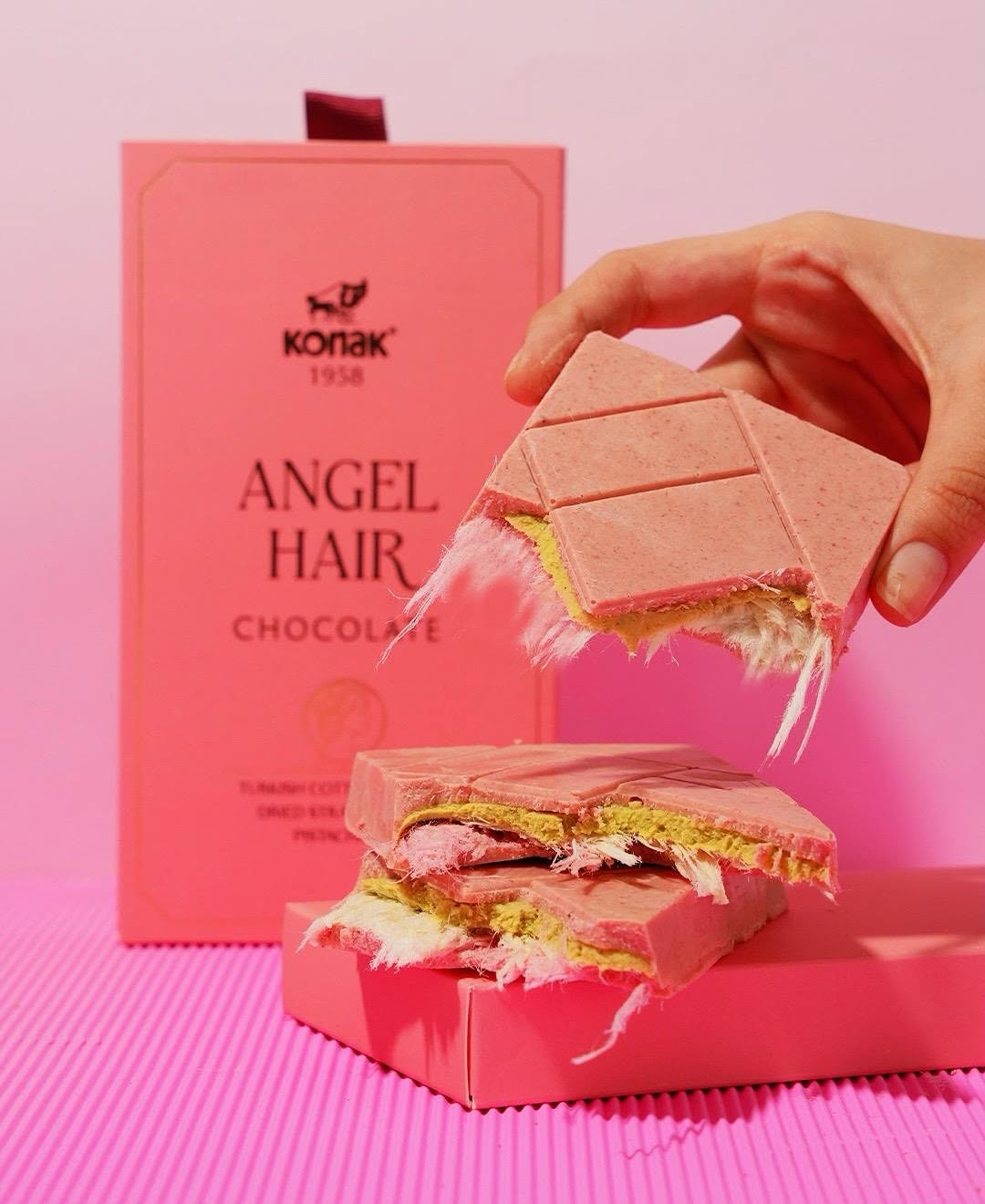 Angel Hair chocolate bar showcasing its fluffy cotton candy and beautiful pink packaging