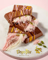 Box of Beyoglu Sweet Angel Hair chocolate with cotton candy and pistachio cream on a white background