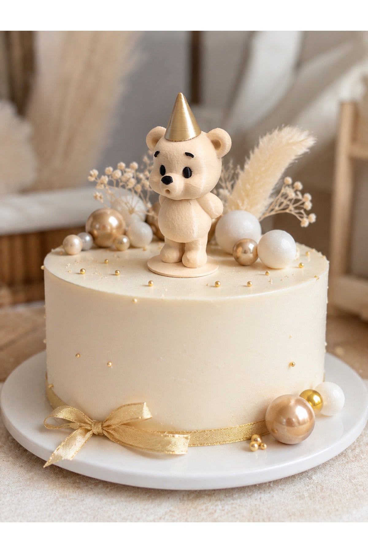 Add a sweet and stylish touch to your celebrations with the Chubby Bear Cake Topper featuring a charming gold party hat.