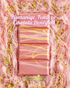 Close-up view of Beyoglu Angel Hair Raspberry White Chocolate showing raspberry strands, pistachio cream filling, and cotton candy texture