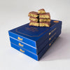 Blue packaging of Senso Gusto Chocolatier Dubai Chocolate with Pistachio on a neutral background