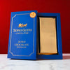 Blue packaging of Senso Gusto Chocolatier Dubai Chocolate with Pistachio on a neutral background