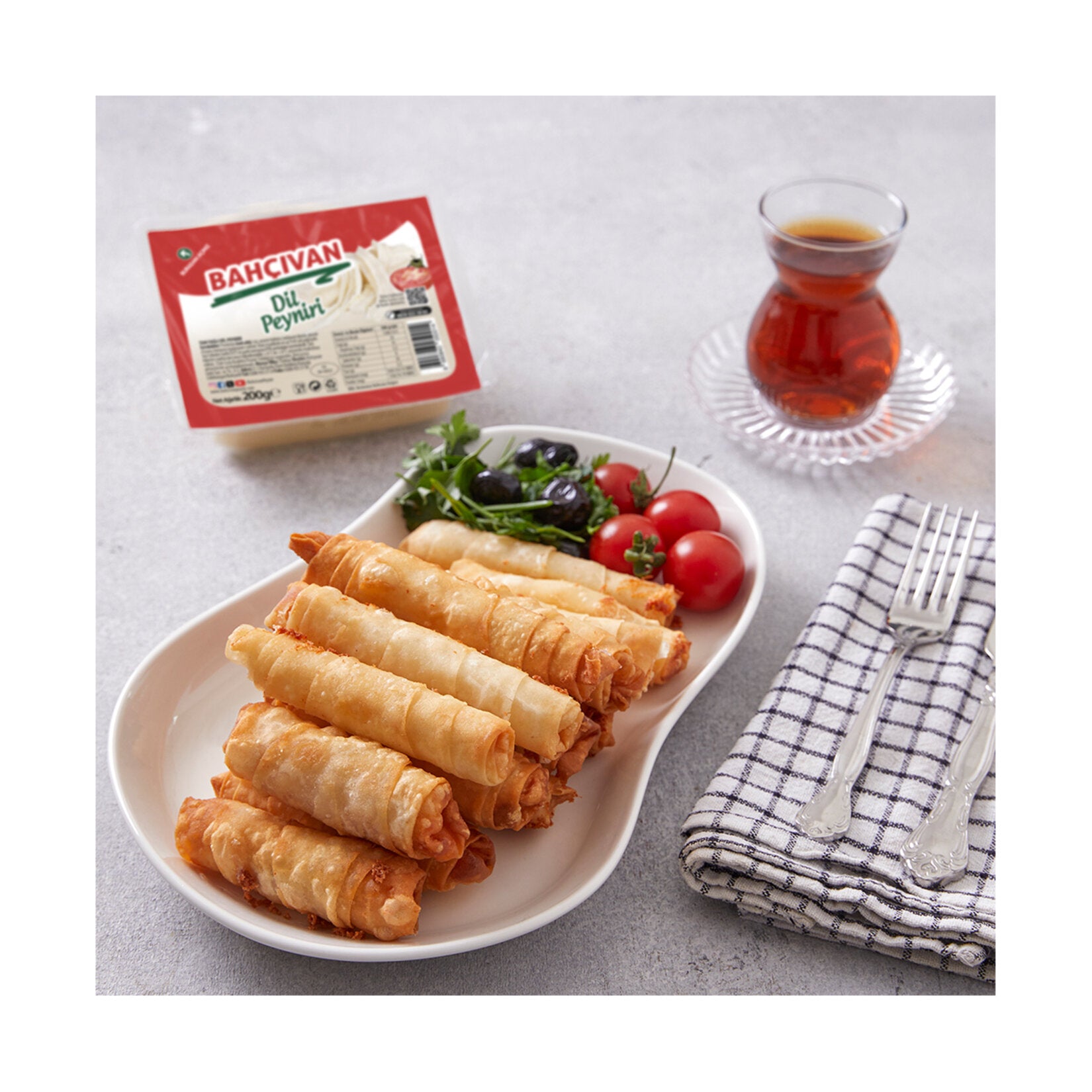 Bahçıvan Dil Peyniri is a traditional Turkish string cheese known for its soft, layered texture that pulls apart into delicate strands.