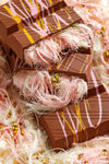 Box of Beyoglu Sweet Angel Hair chocolate with cotton candy and pistachio cream on a white background