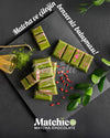 Two pieces of Beyoglu Matchico Matcha Chocolate- Matcha-infused white chocolate filled with raspberry cream and strawberry pieces