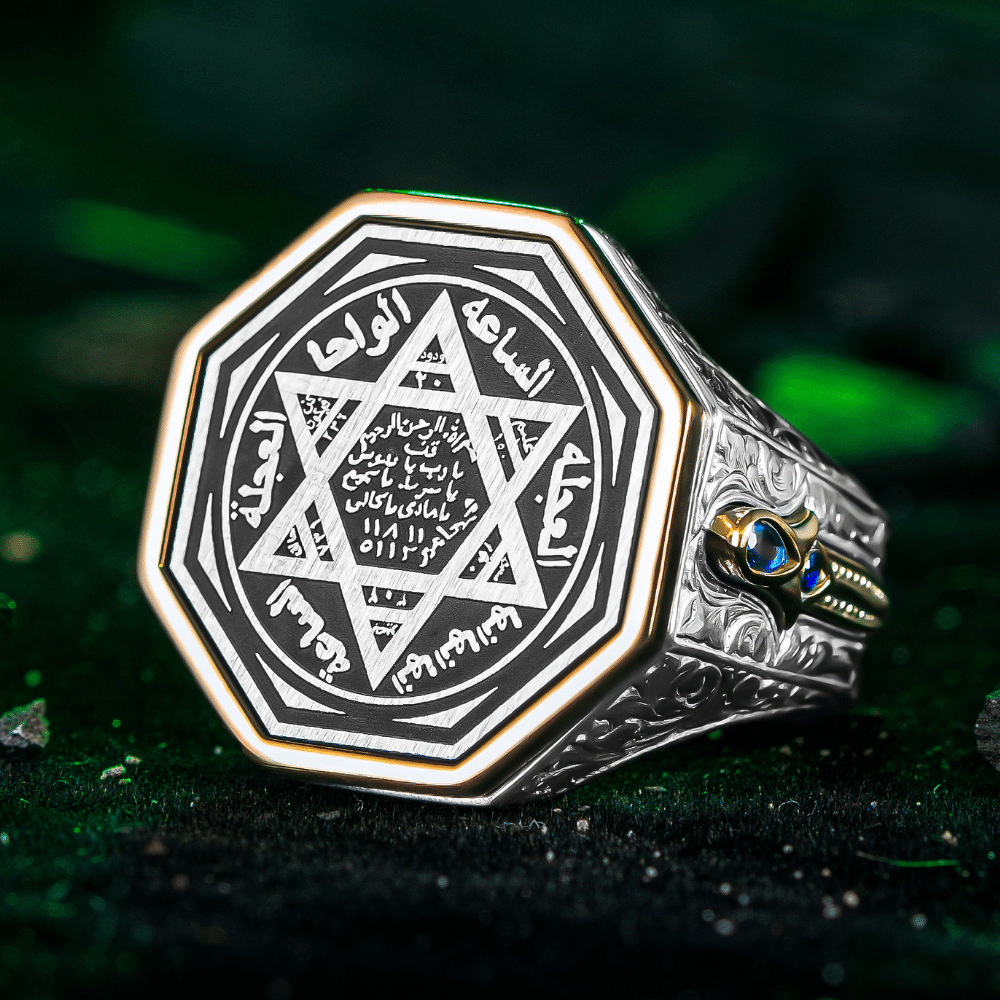 Crafted from solid 925 Sterling Silver, this Turkish Sterling Silver Ring with Blue Suleiman Seal features intricate engraved detailing and a striking blue stone accent at its center.