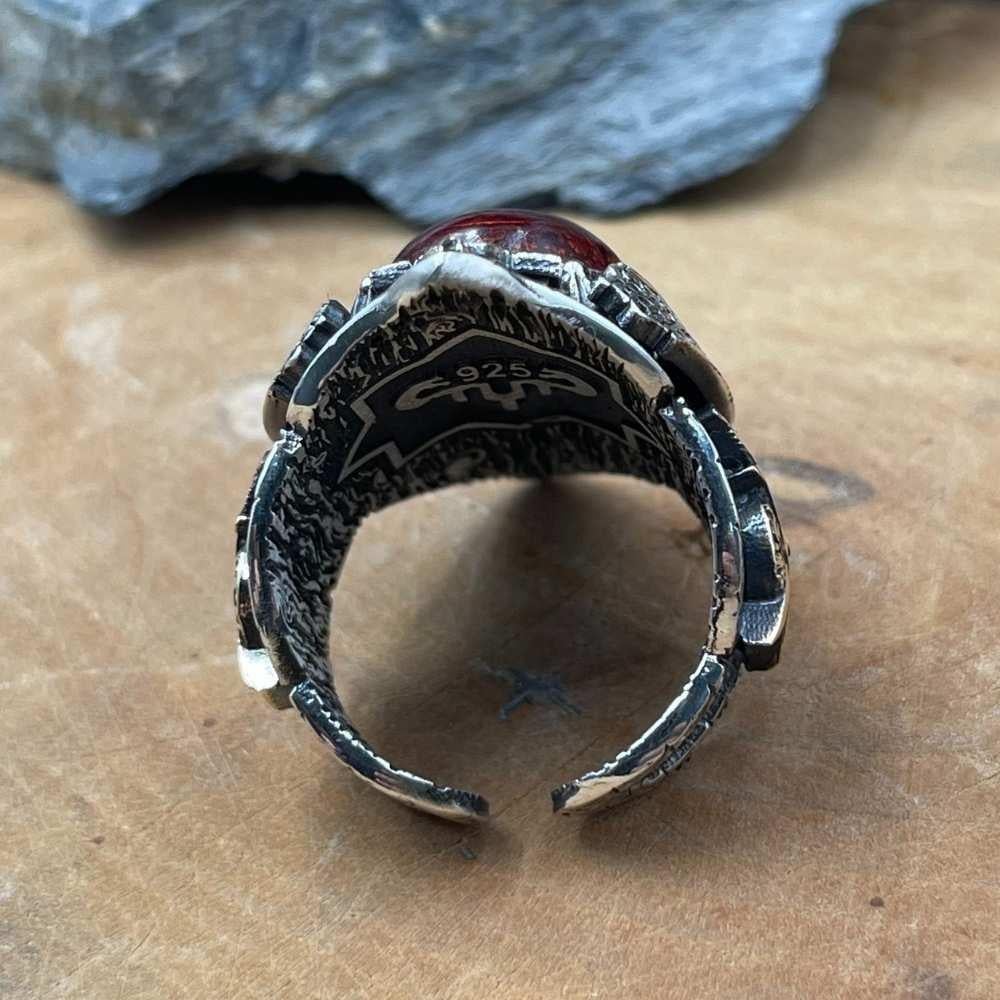 Turkish Sterling Silver Zihgir Ring with Red Amber is a bold statement piece inspired by Ottoman archery heritage and rich Islamic artistry.